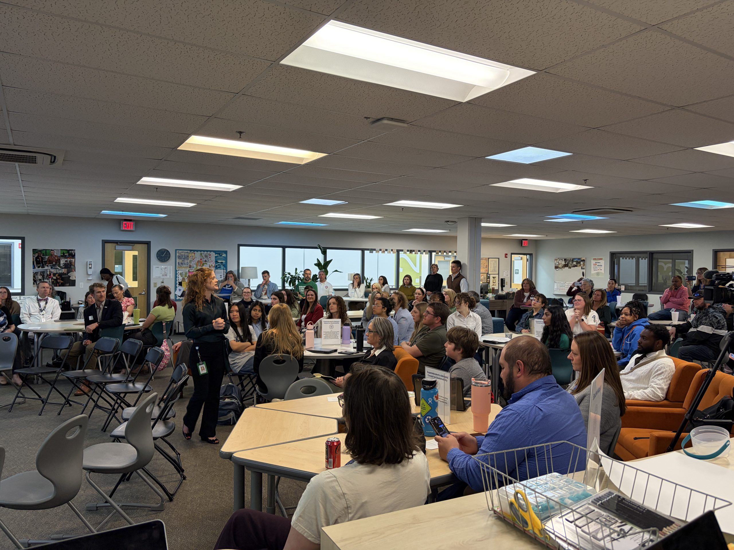 Students, educators, and community members gathered at the Fayette County Public Schools Student Sustainability Symposium, listening to student presentations on sustainability initiatives in Lexington, Kentucky.